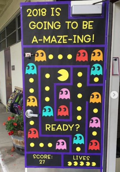 Pacman themed classroom door with text reading 2018 is going to be a-maze-ing.