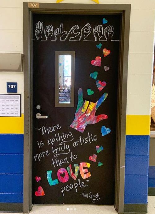 Classroom door with sign language for love. Text reads There is nothing more truly artistic than to love people. - Van Goghna