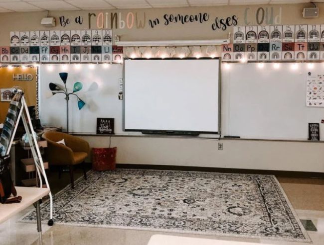 Classroom with a large area rug and neutral rainbow colors