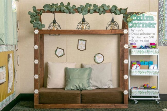 A classroom reading corner with faux eucalyptus over top