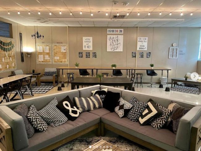 A high school classroom with a couch seating area and cozy theme