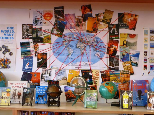 World map with strings to various books from different parts of the globe