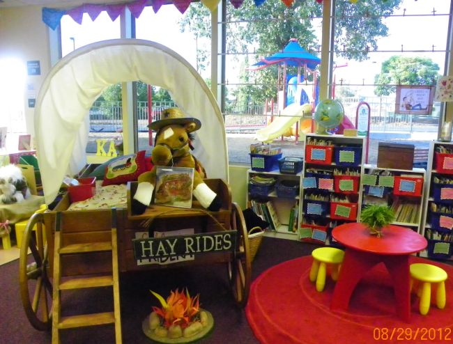 Wild West-themed classroom with a large covered wagon as a centerpiece