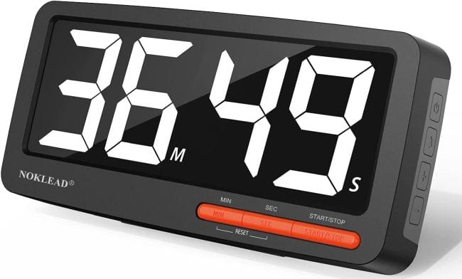 Large digital timer with black screen and white numbers reading 36:49