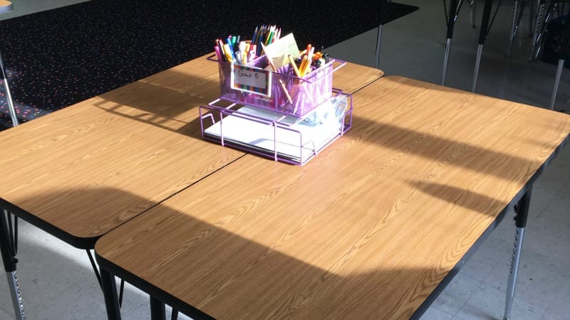 What are the pros and cons of student tables instead of desks?