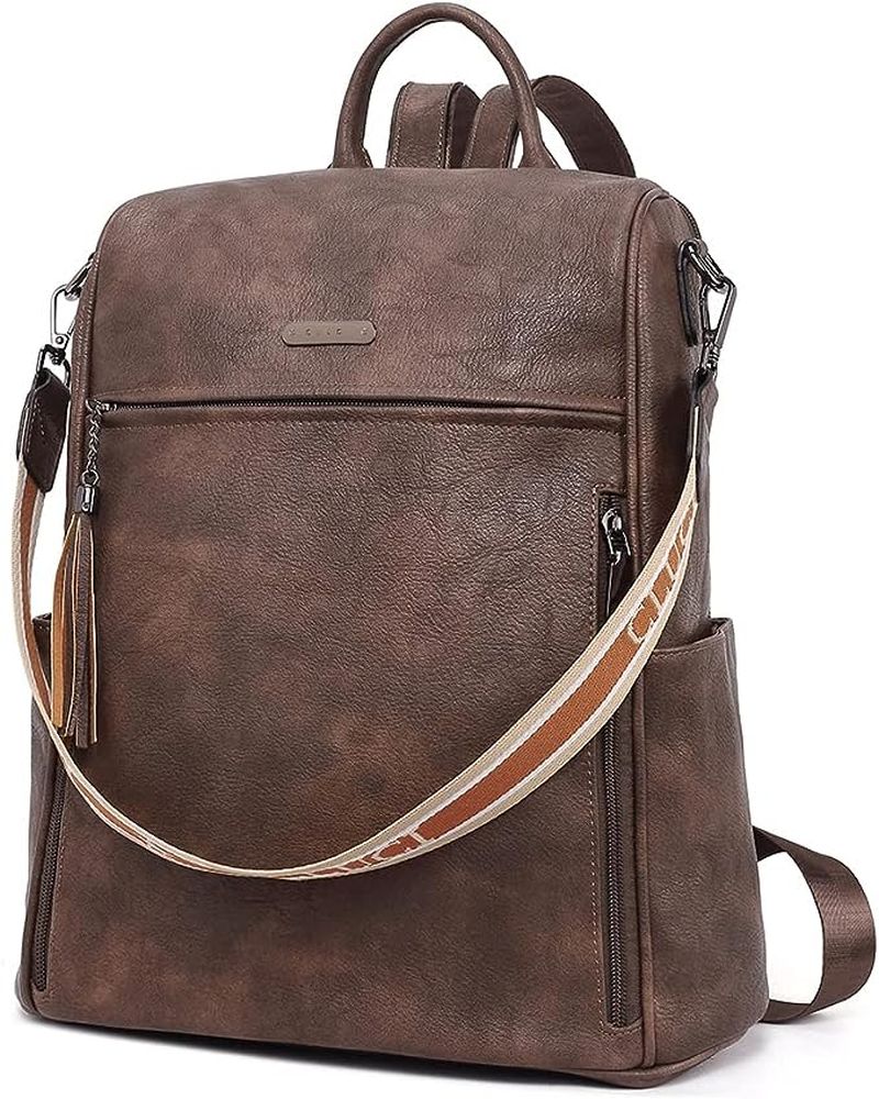 Simple leather backpack with top handle, front zipper pocket, and colorful sling strap
