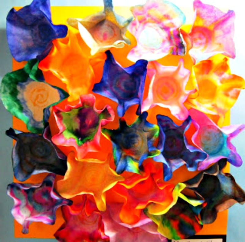 Bright Chihuly-style sculptures made from coffee filters as an example of school auction art projects