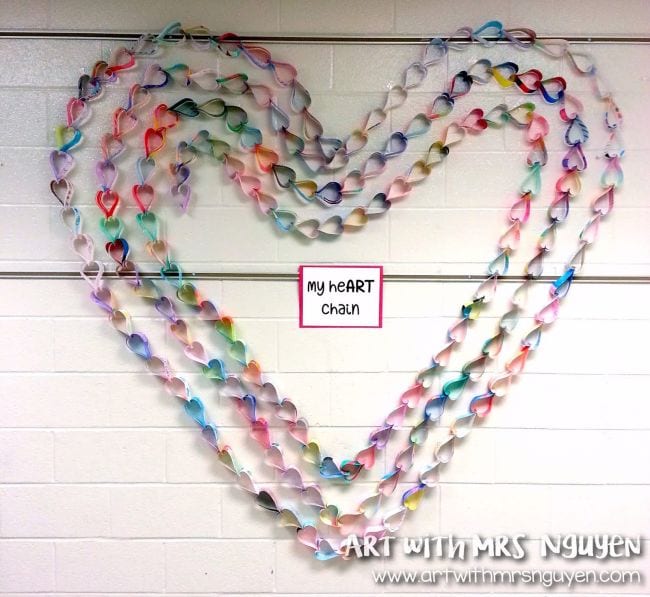 Collaborative art projects can be 3-D like this one that takes individual 3-D hearts and combines them into larger hearts that form a paper chain.