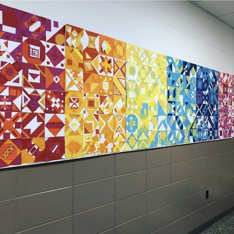 Geometric paper quilt blocks in a rainbow of colors