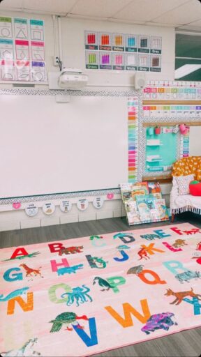 Kindergarten classroom with colorful alphabet animal rug.