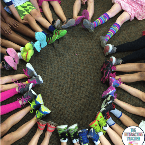 colorful shoes and socks of kids seated in a circle with their feet touching as an example of bucket filler activities