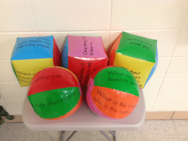 Inflatable balls and cubes with reading comprehension questions written in sections as a third grade reading comprehension activity