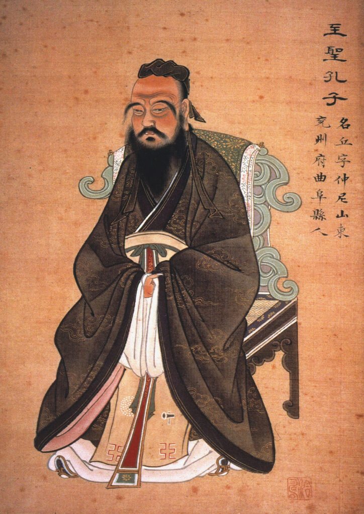 Famous philosophers include Confucious shown here sitting in a portrait. Chinese writing is on the right side of the painting.