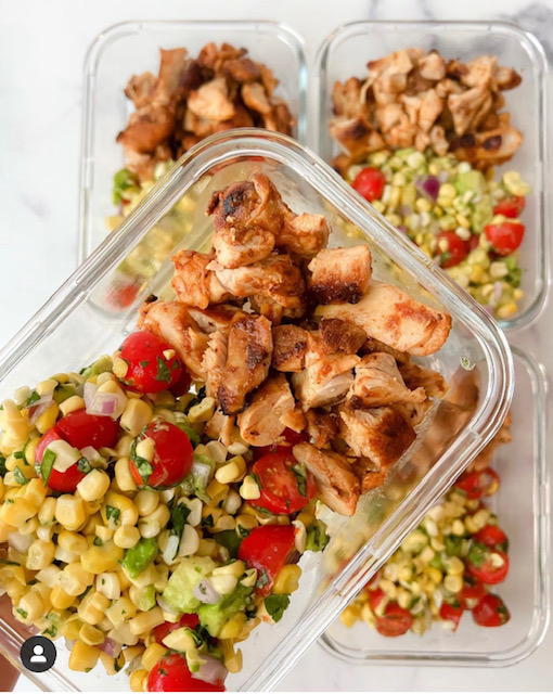 Chipotle chicken bowls with corn salsa in glass containers