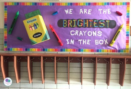 A purple background has the words "we are the brightest crayons in the box" with a crayon box and several different colored crayons around it.