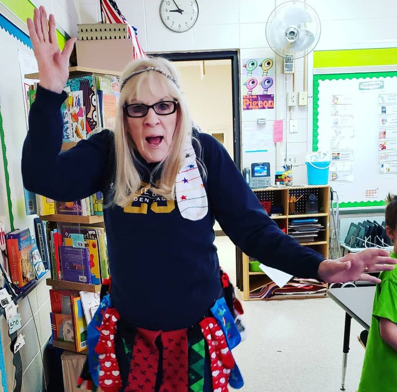 Teacher wearing a skirt made of silly socks for Crazy Sock Day