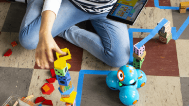 Elementary student using coding and robotics across core subjects