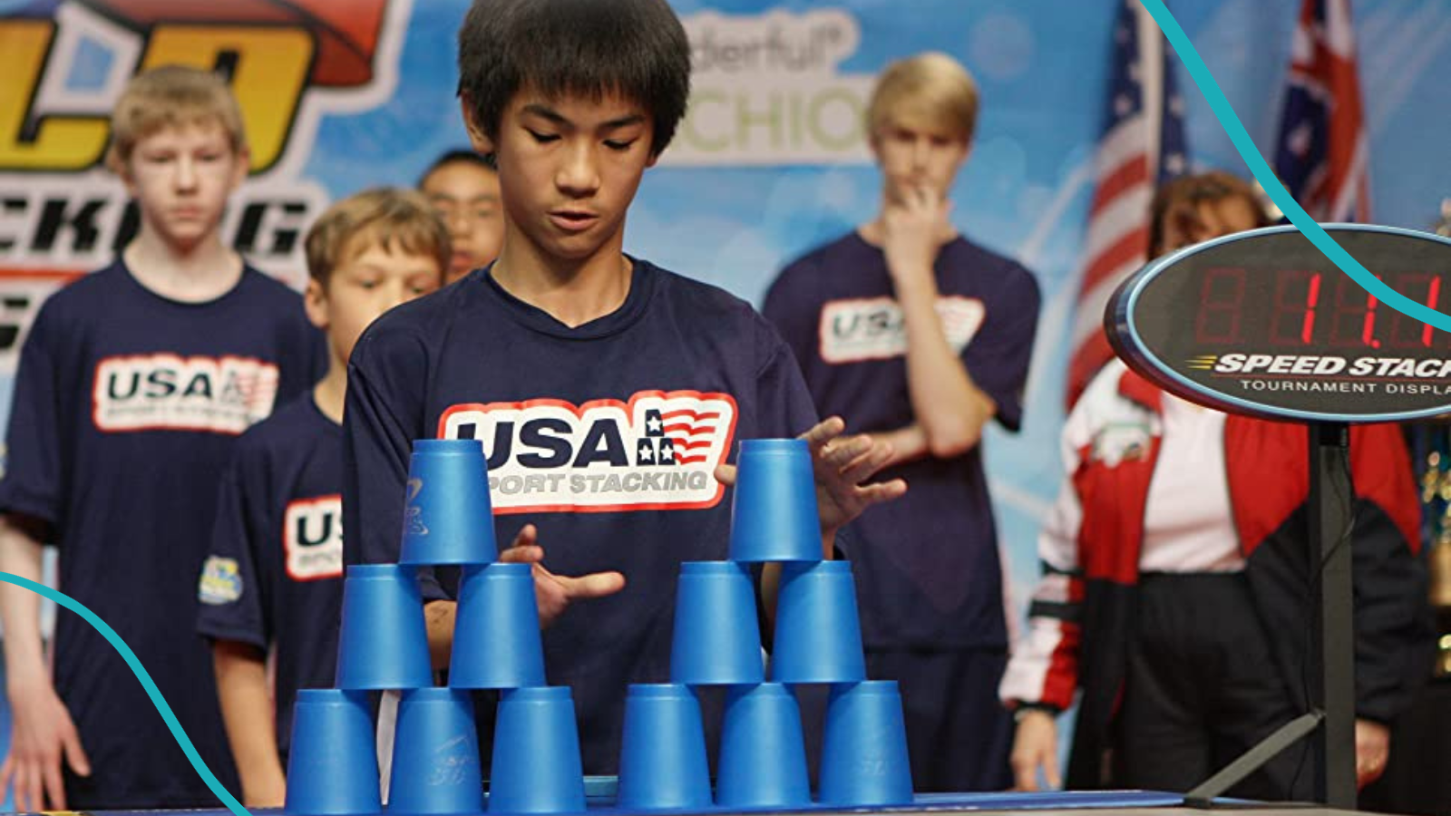 Competitors stacking pyramids of blue plastic cups in a sport stacking competition