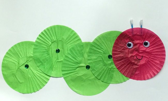 A caterpillar is made from green and red flattened cupcake liners. (very hungry caterpillars)