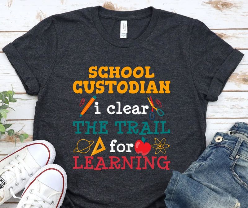 Black t-shirt with colorful text reading School Custodian: I clear the trail for learning
