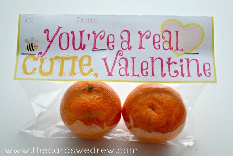 Cellophane bag containing two clementines and a card that says, "You're a real cutie, valentine"