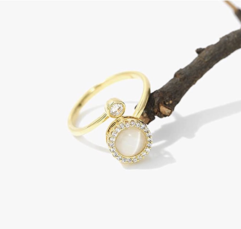 Gold fidget ring with cubic zirconia spinning top