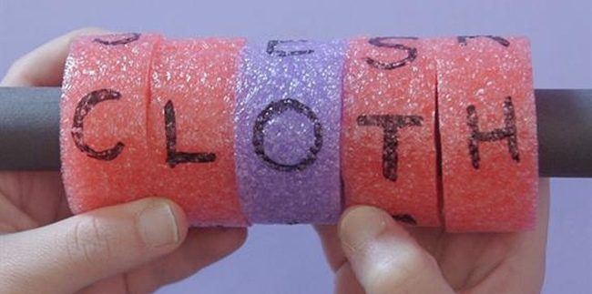 Student turning letter beads made from pool noodle pieces