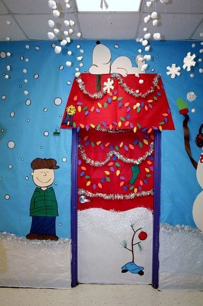 Classroom door decorated to look like Snoopy's doghouse from Charlie Brown's Christmas