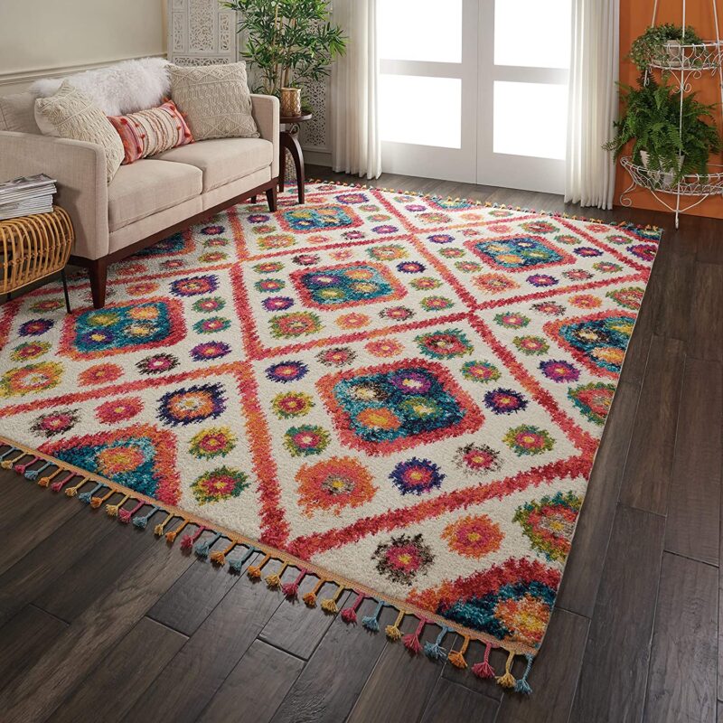 Colorful patterned rug with tassels.