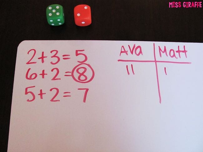 whiteboard with math equations and tally marks and dice