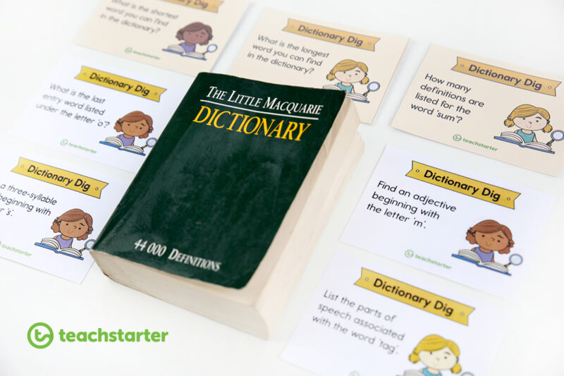A dictionary surrounded by vocabulary task cards as an example of vocabulary activities