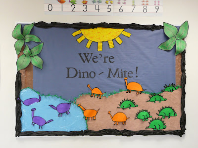 We're dino-mite dinosaur themed bulletin board