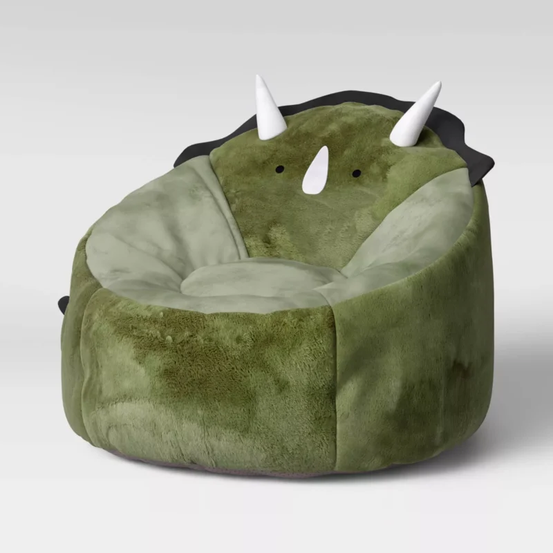 Bean bag chairs for kids include this green option that has a dinosaur face and horns.