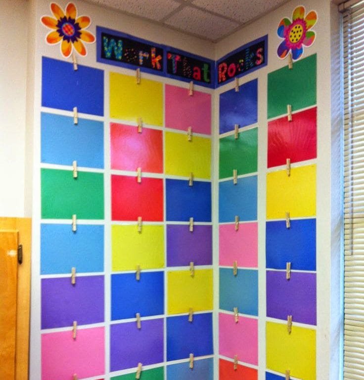 Laminated colored paper hanging on classroom wall