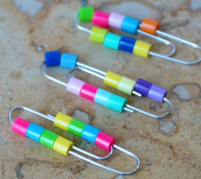Colorful pony beads strung onto paperclips