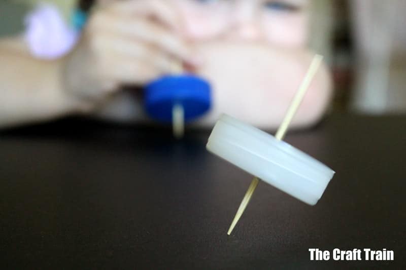 Bottle spinning top