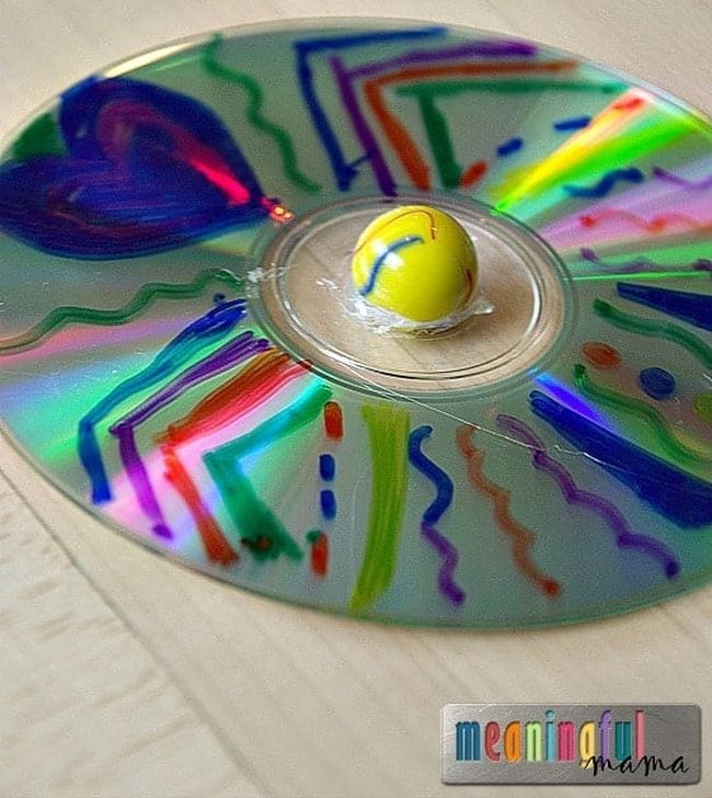 Colorful spinning top made from an old CD and a marble (DIY Fidgets)