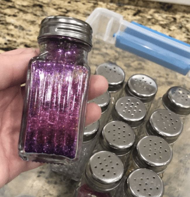 Salt shaker filled with purple glitter as an example of dollar store hacks for the classroom 