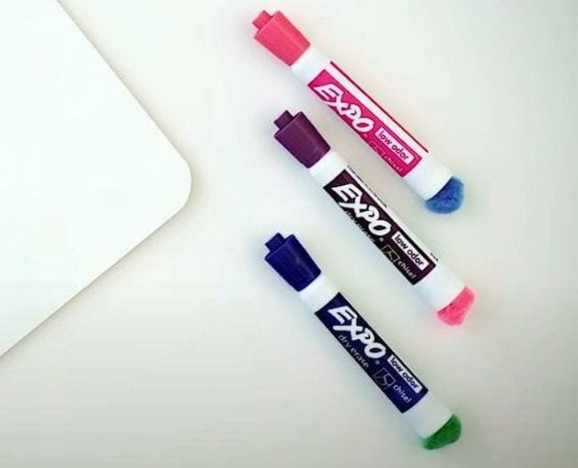 Expo dry erase markers with pom poms glued to the bottom (Dollar Store Hacks)