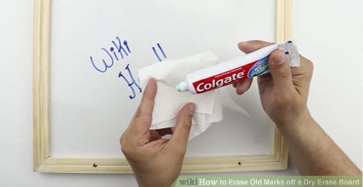Teacher using toothpaste on a rag to clean a white board (Dollar Store Hacks)