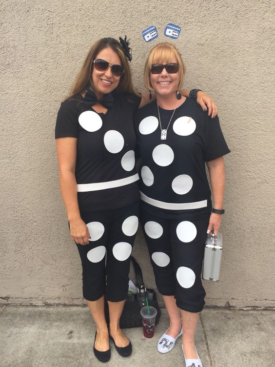 Two women are dressed as dominoes.