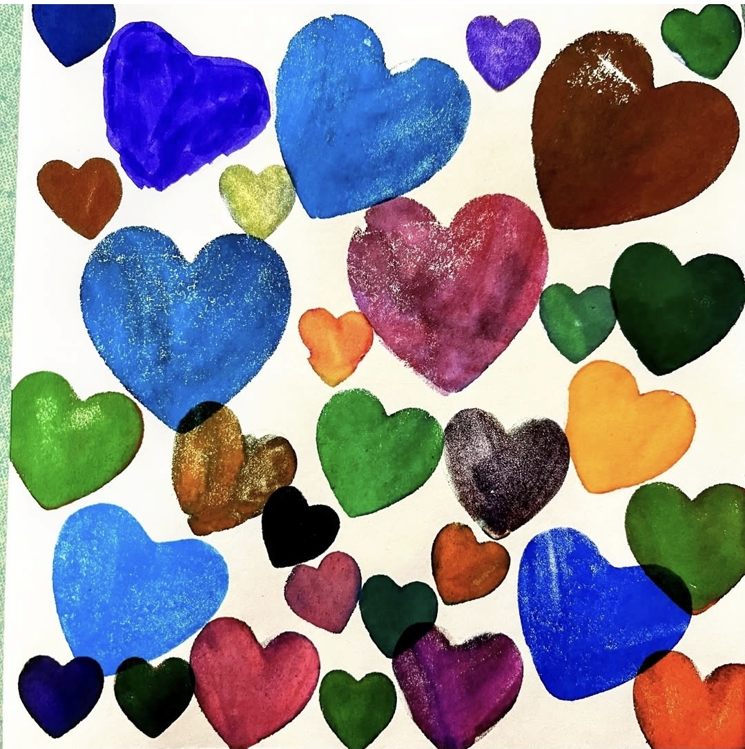 Colorful hearts made with foam stamps