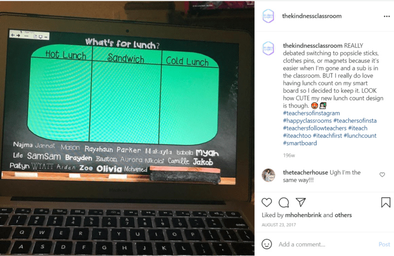 Teacher black laptop doing digital lunch count in classroom