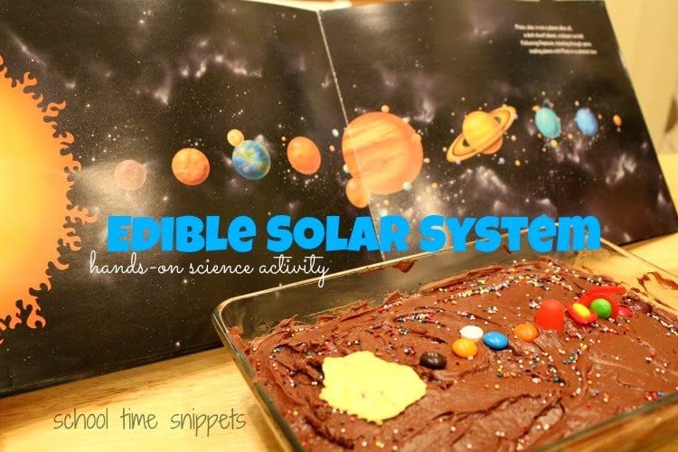 a sheet cake decorated with the layout of the solar system