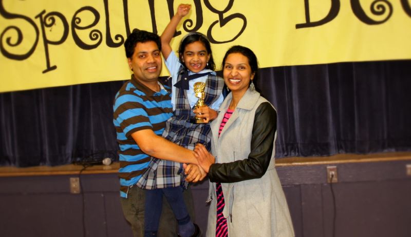 Family posing together after child has won National Spelling Bee