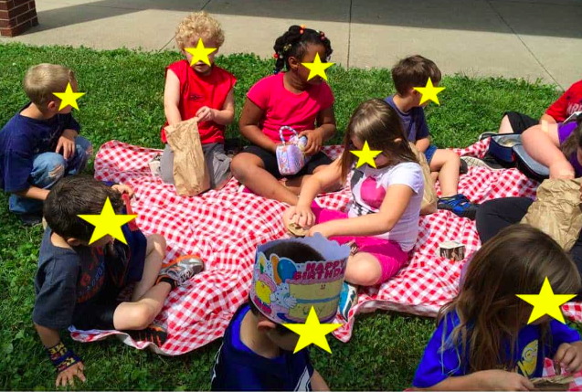 Children enjoying an outdoor picnic