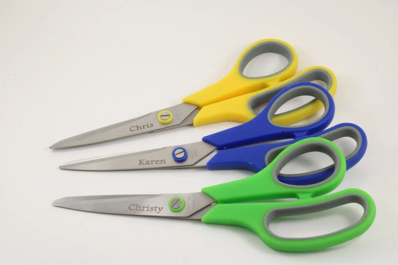 three sets of scissors have names engraved on them.