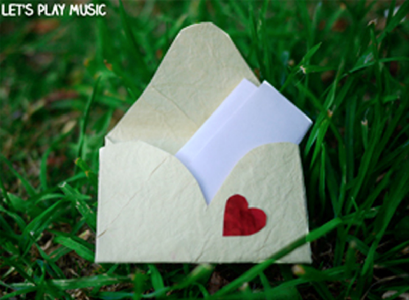 Recess games can include props like this white envelope with a small red heart on it with a folded paper in it.
