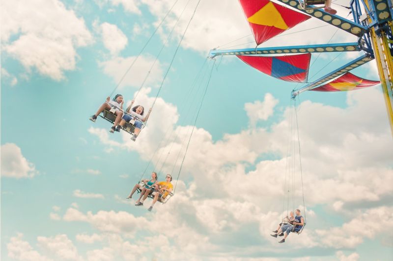 Children writing a fairground swing ride