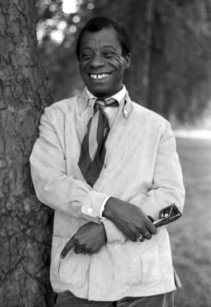 James Baldwin portrait outdoors by a tree